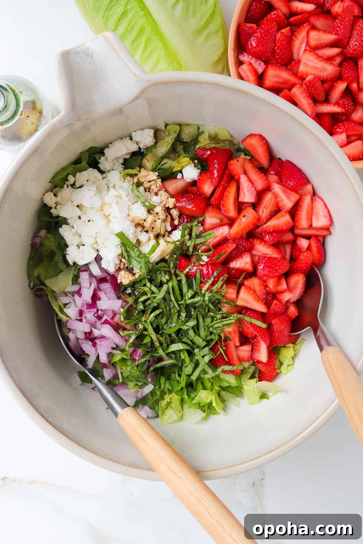 Strawberry and Goat Cheese Salad with Balsamic Glaze 5 All of the salad ingredients in a large mixing bowl, unmixed.