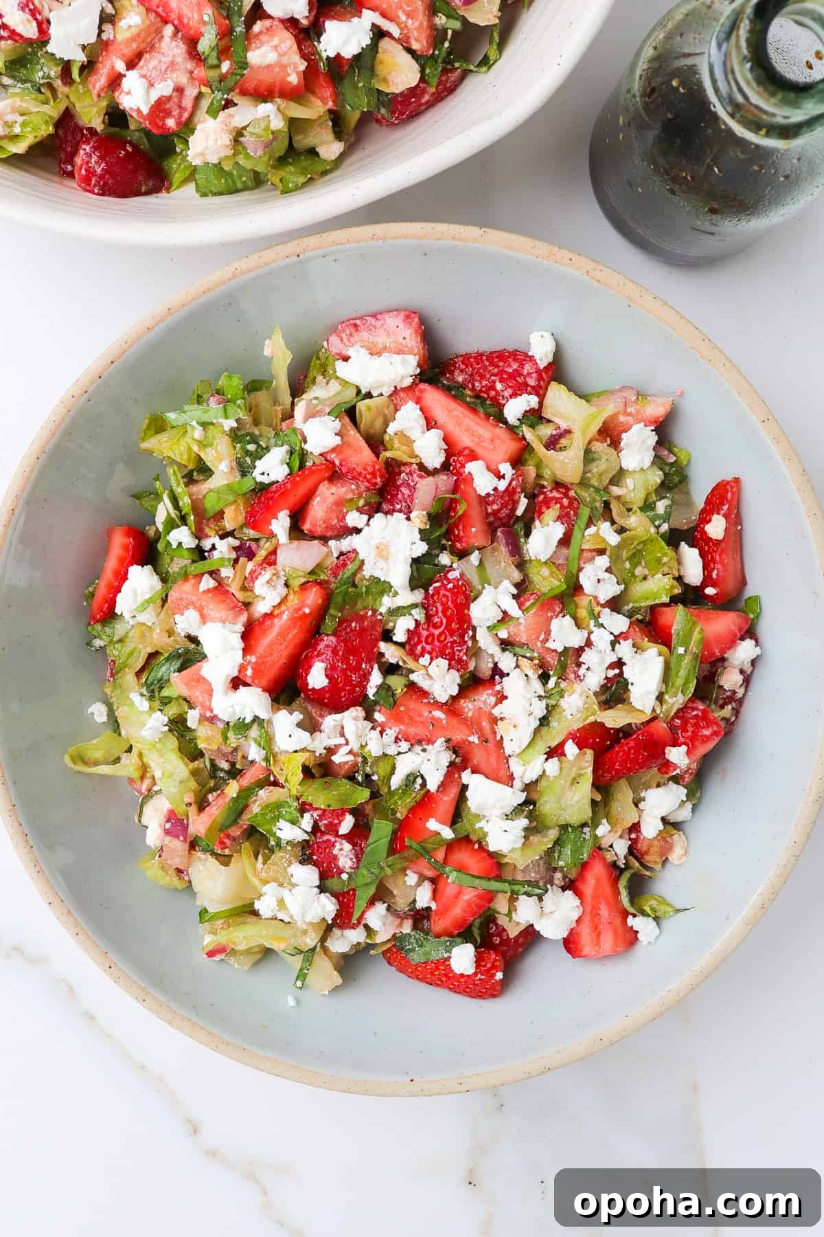 Strawberry and Goat Cheese Salad with Balsamic Glaze 8 Strawberry goat cheese salad in a blue bowl.