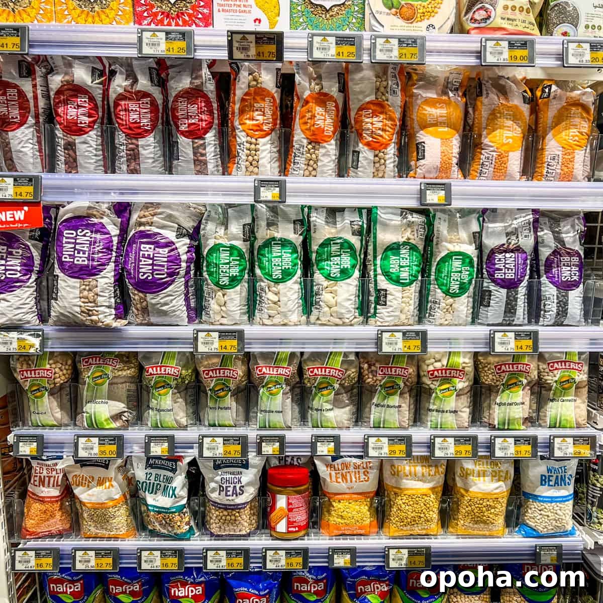 Photo of rows of shelves of dried bean packets in a supermarket.