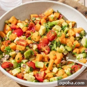 close up overhead view of mango avocado salsa in a large shallow bowl.