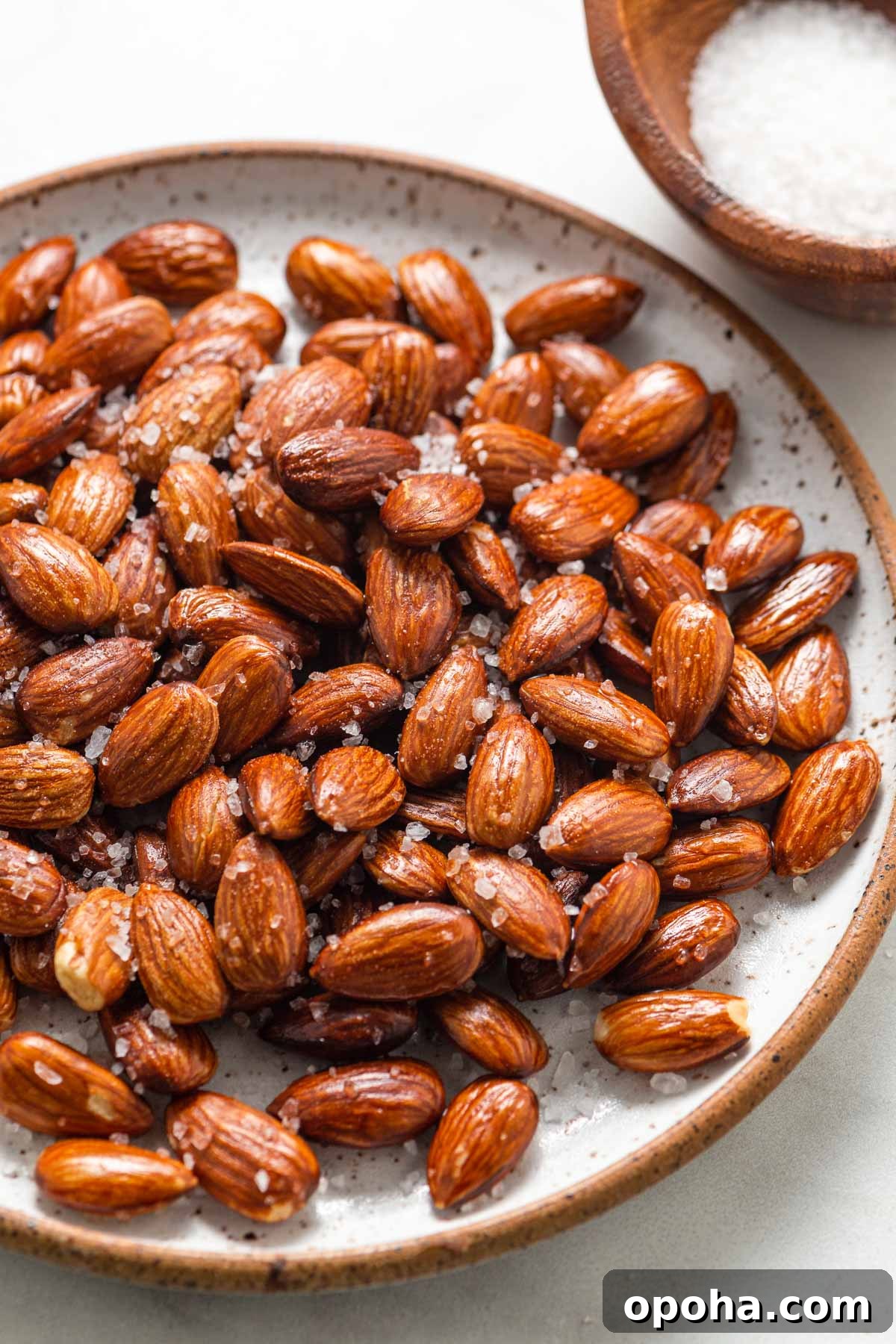 Roasted almonds on a plate.