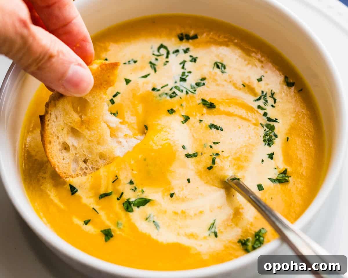 Ginger Curry Parsnip and Carrot Soup Recipe 2 Dipping a grilled crostini into the parsnip and carrot soup.