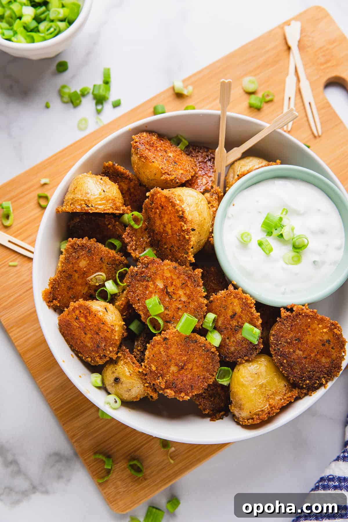 cooked potatoes in a bowl with dipping sauce