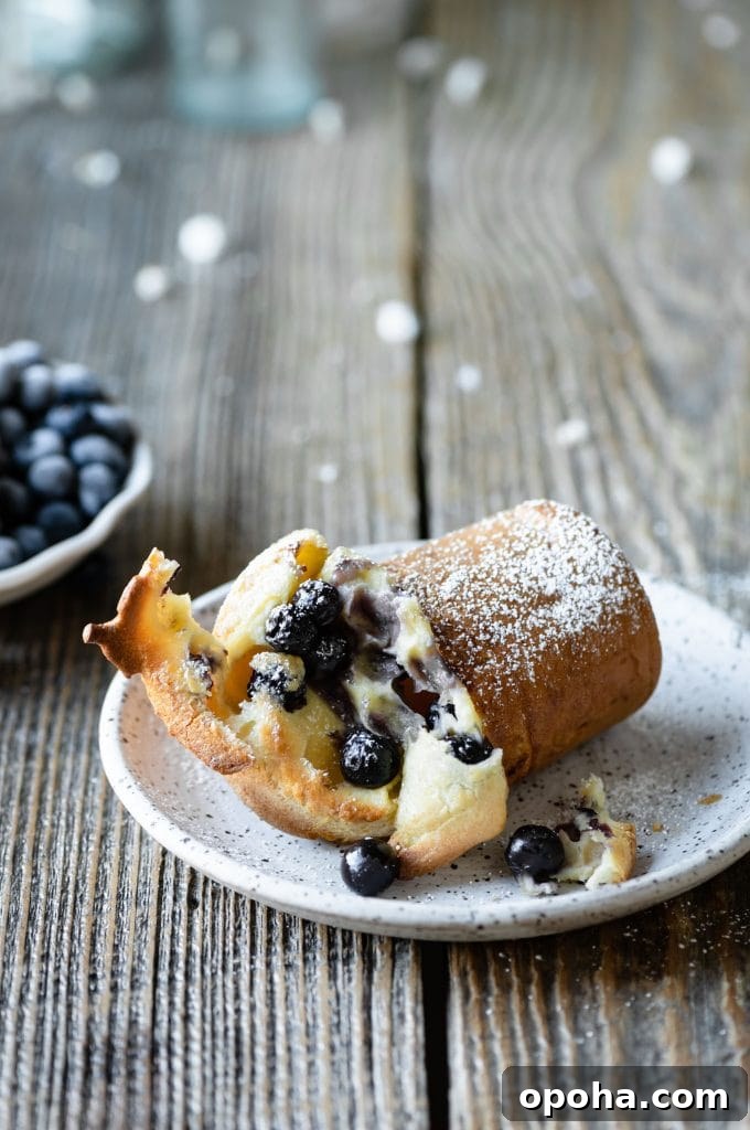 Fluffy Blueberry Popovers: Light, Crispy Breakfast Treat 6 Blueberry Popover on Plate