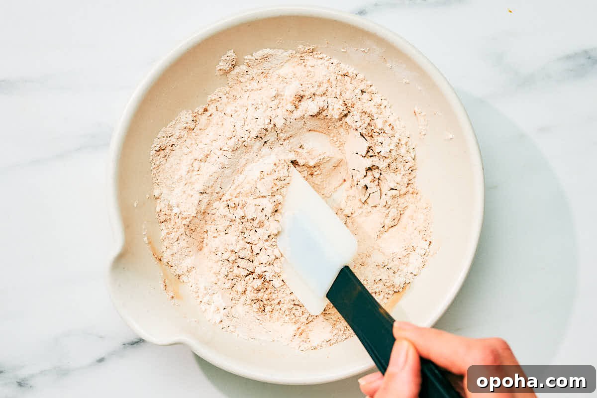 High-Protein Cottage Cheese Pancakes for Muscle Gain and Weight Loss 7 Mixing together dry ingredients for cottage cheese pancakes recipe.