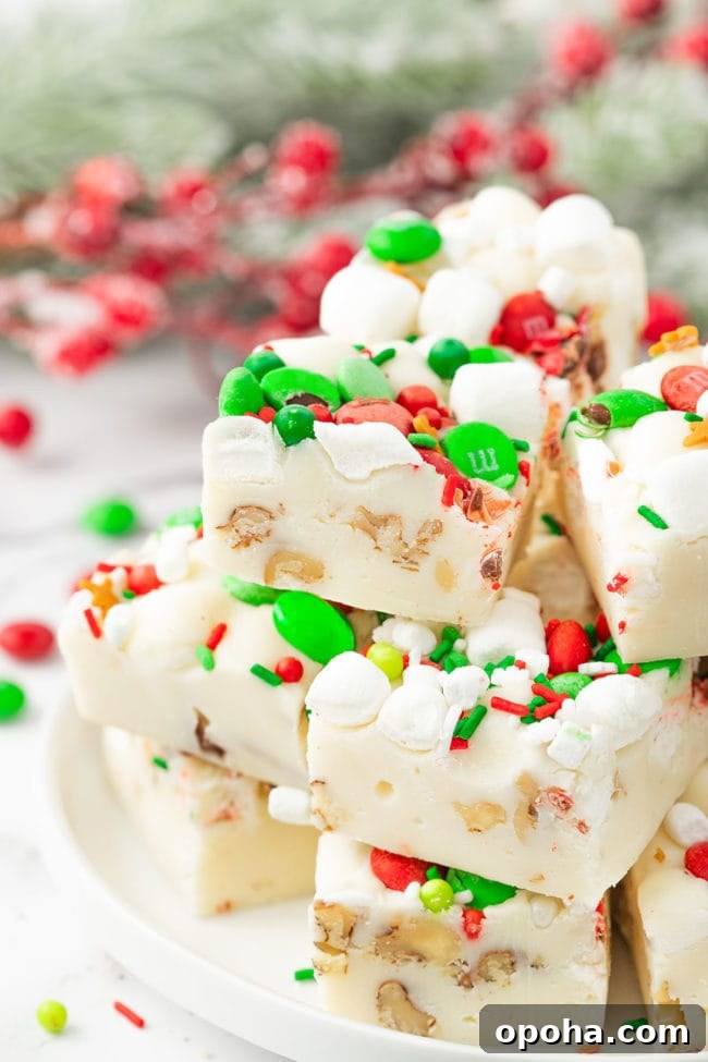 white rocky road fudge stacked on a white plate
