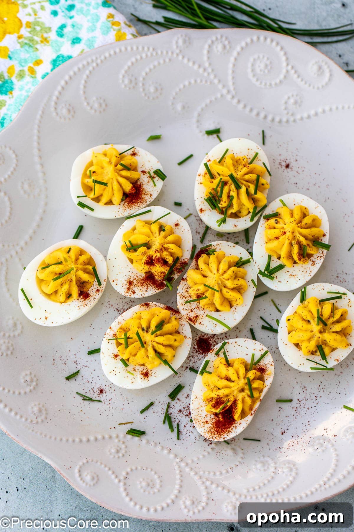 Classic Southern Deviled Eggs Recipe with Tangy Mustard-Fill 2 Platter of decorated deviled eggs.