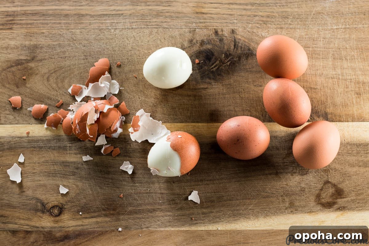 Classic Southern Deviled Eggs Recipe with Tangy Mustard-Fill 3 Perfect Hard Boiled Eggs on a chopping board