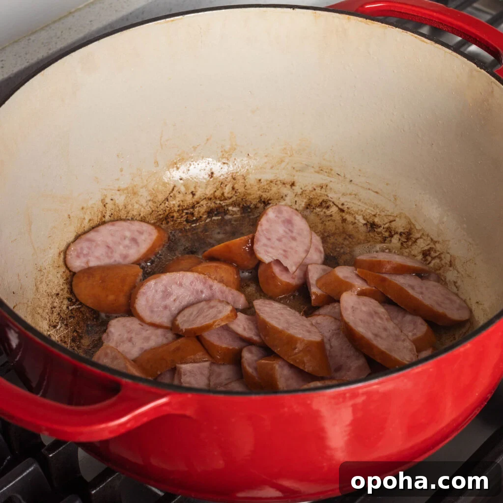 Southern-Style Fried Cabbage Recipe for Bold Flavor 6 browning smoked sausage in dutch oven