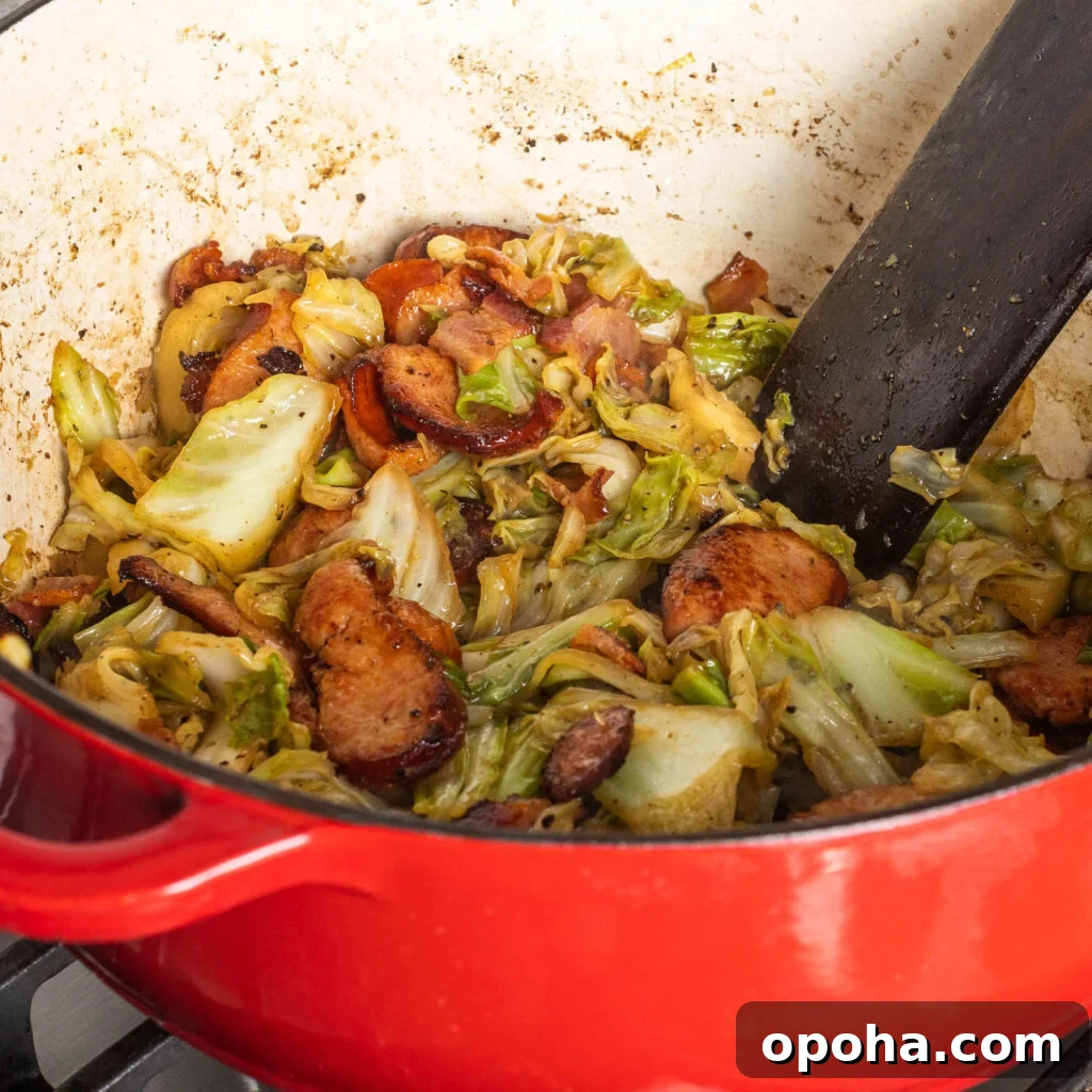 Southern-Style Fried Cabbage Recipe for Bold Flavor 8 sauteing cabbage, bacon and sausage in a dutch oven