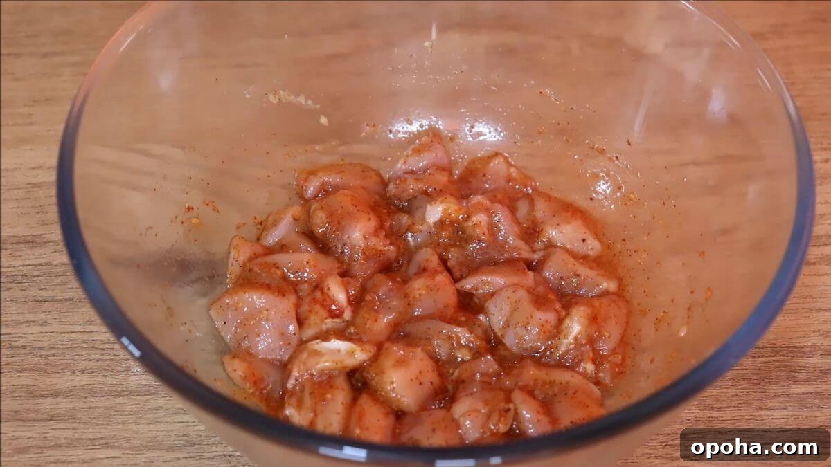 Crispy Homemade Popcorn Chicken Recipe for Snack or Dinner 4 marinating the chicken to make popcorn chicken at home.