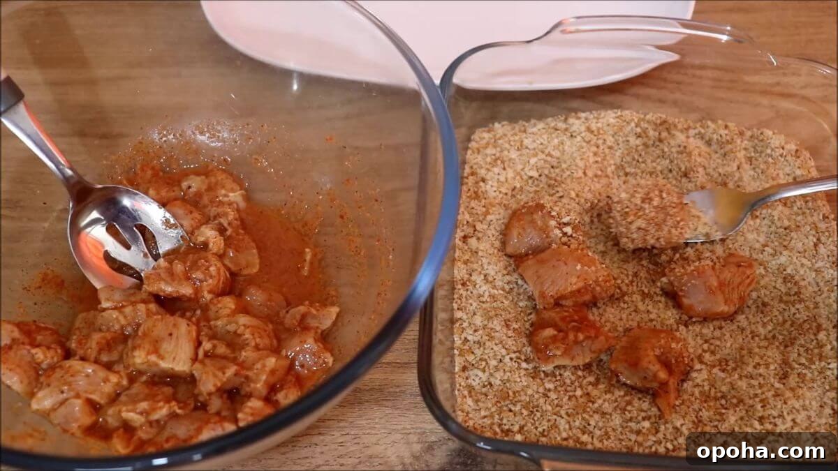 Crispy Homemade Popcorn Chicken Recipe for Snack or Dinner 5 coating the chicken pieces with breadcrumbs to make homemade popcorn chicken.