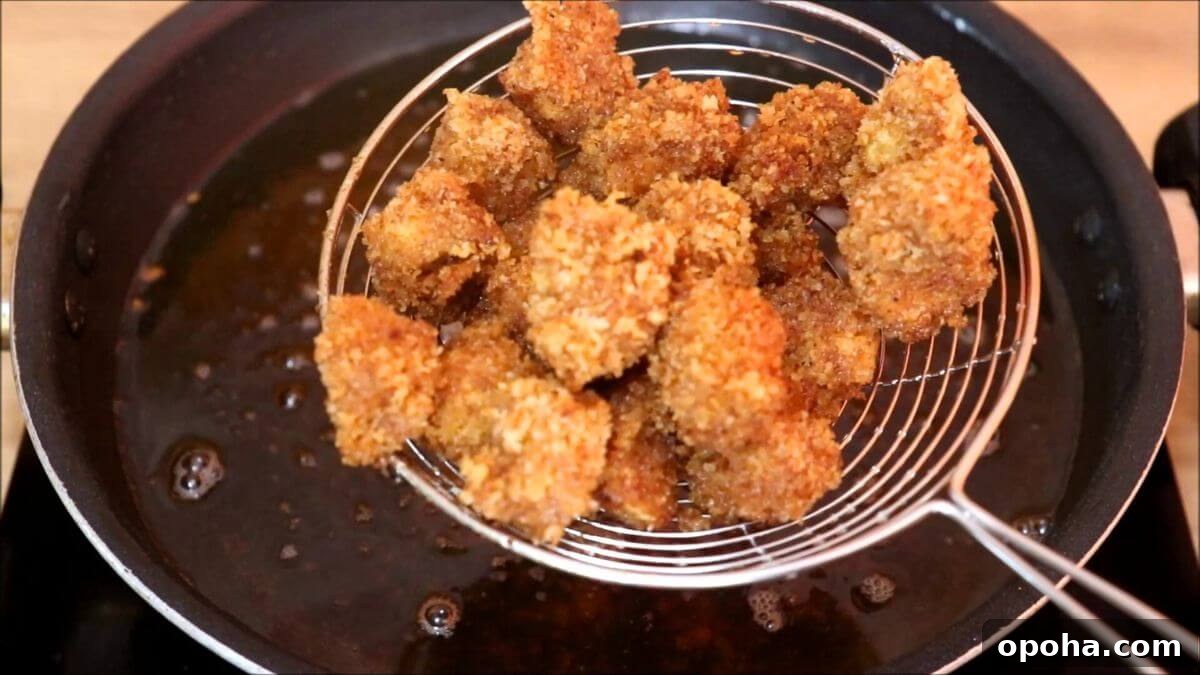 Crispy Homemade Popcorn Chicken Recipe for Snack or Dinner 7 fried crispy popcorn chicken.
