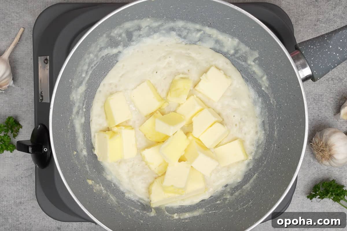 Remaining butter added to the pan.