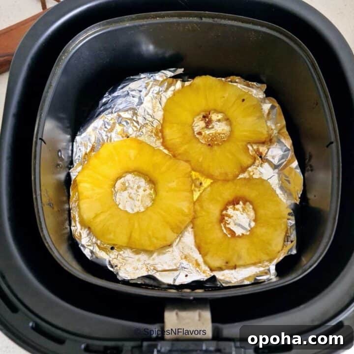 Air Fryer Cinnamon Pineapple Recipe — Grilled Flavor in Minutes 7 place the smeared pineapple rings in your air fryer basket