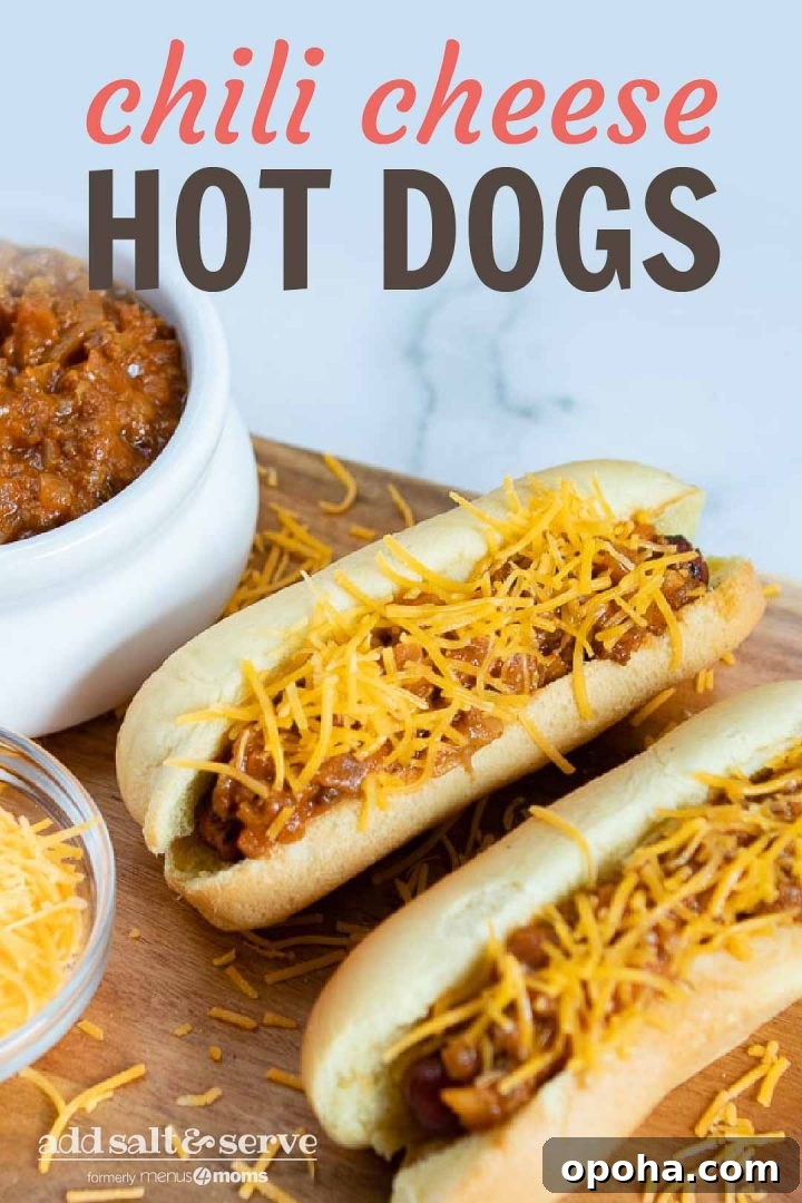 Loaded Chili Cheese Hot Dogs Recipe with Homemade Chili 3 Two hot dogs in buns topped with chili and shredded cheese, a bowl of shredded cheese, and a bowl of chili. Text Chili Cheese Hot Dogs Add Salt & Serve formerly Menus4Moms