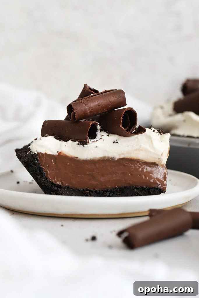 Gluten-Free Banana Cream Pie Recipe — Light, Silky & Delicious 10 a slice of gluten-free chocolate cream pie topped with whipped cream and chocolate curls