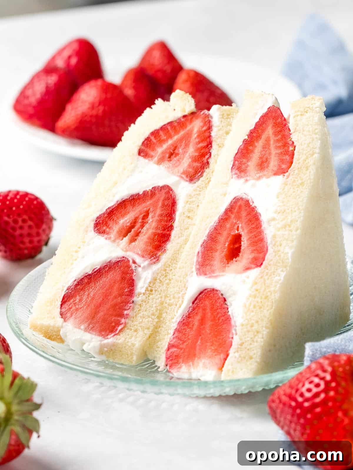 Japanese Fruit Sandwich (Strawberry Sando): How to Make フルーツサンド 14 Japanese strawberry fruit sando made with soft milk bread and fluffy whipped cream sliced in half.