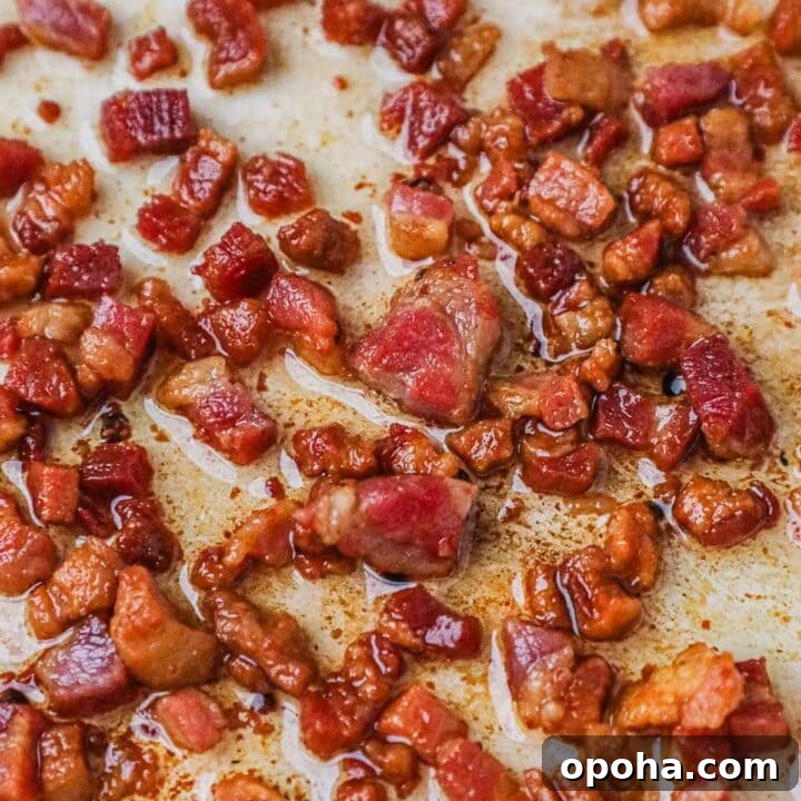 Crispy pancetta in a Le Creuset braiser, used as a topping for pizza, pasta, salads, and more.