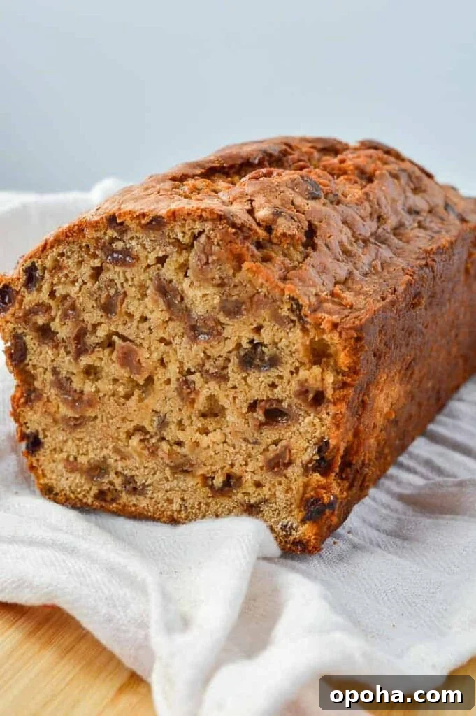 Traditional Irish Barmbrack Recipe for Perfect Fruit Tea Bread 2 A cut loaf with raisins and sultanas on a white cloth