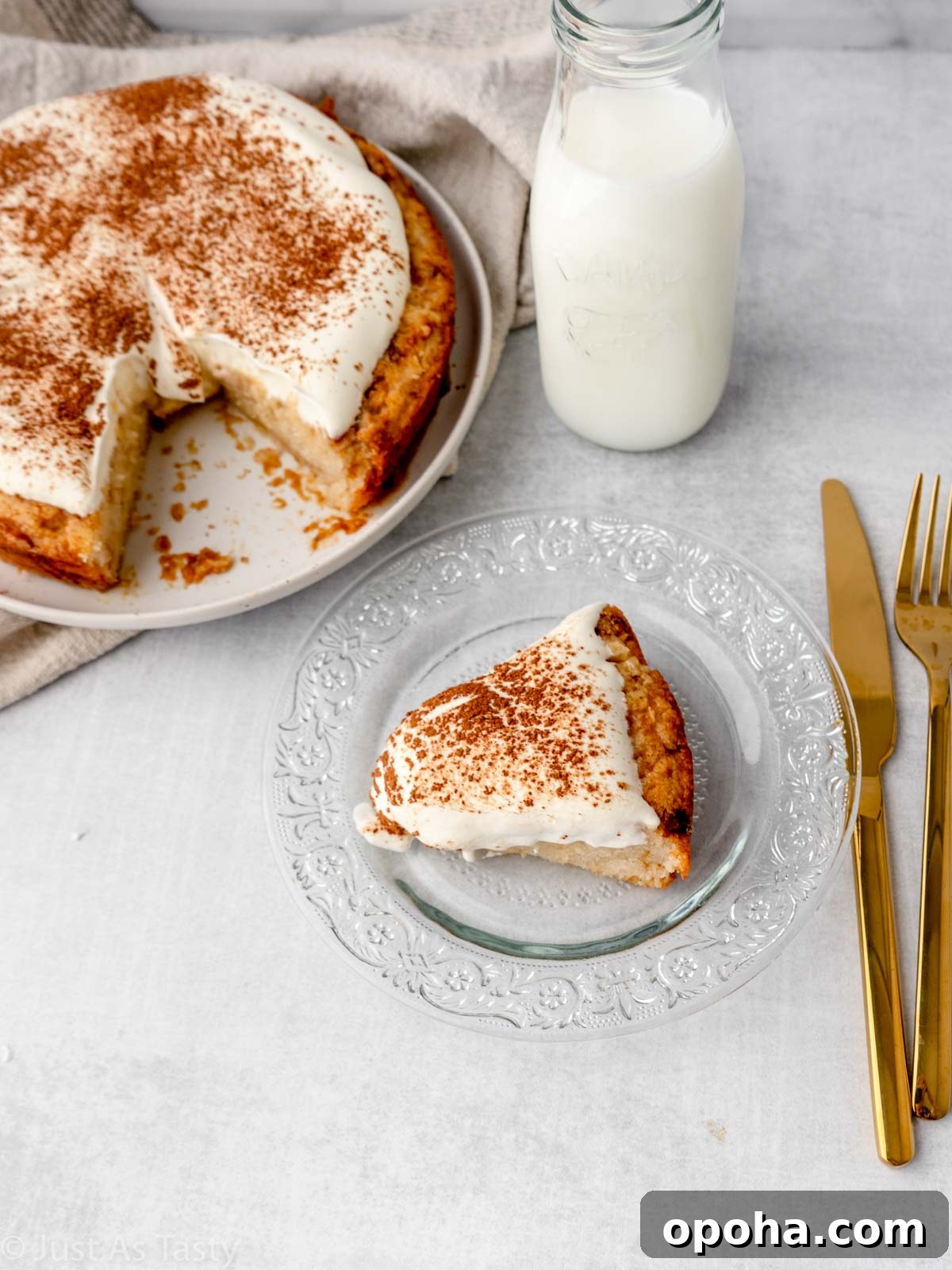 Slice of gluten free tres leches cake on a glass plate. 