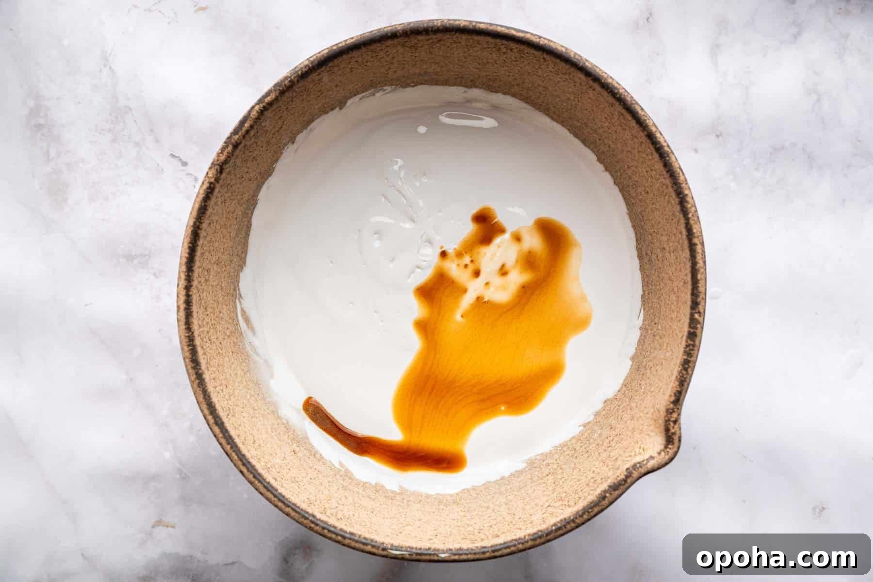 How to Make Homemade Marshmallows from Scratch: Fluffy Recipe 9 White fluff with vanilla splashed on top.
