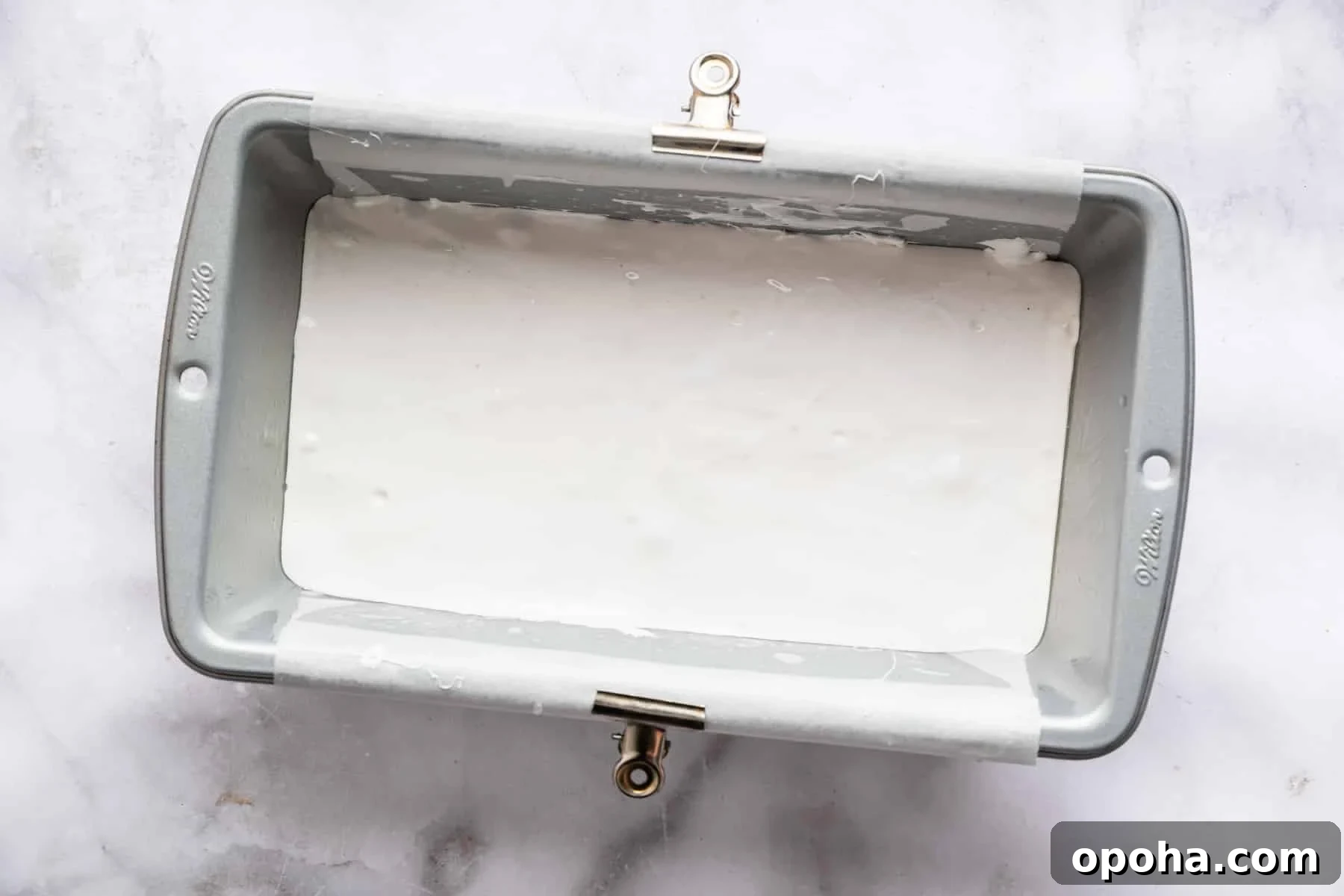 How to Make Homemade Marshmallows from Scratch: Fluffy Recipe 10 White fluff in a bread loaf pan.