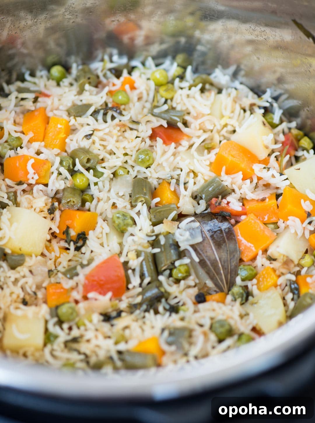 Close up photo of vegetable pulao made with vegetables and whole spices in an Instant pot