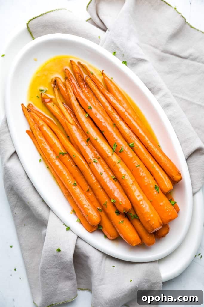 Maple-Glazed Roasted Carrots with Herbs and Balsamic 2 Maple carrots sprinkled with parsley.