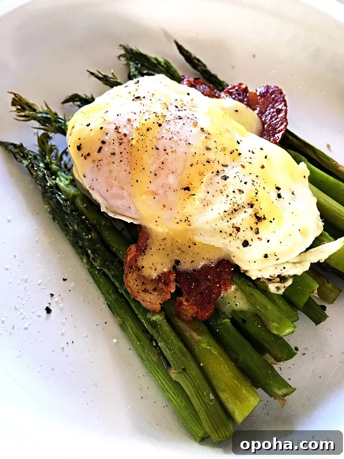 Eggs Benedict with Asparagus Recipe - This Eggs Benedict with Asparagus makes a delicious recipe for breakfast, brunch or even a light supper! // addapinch.com