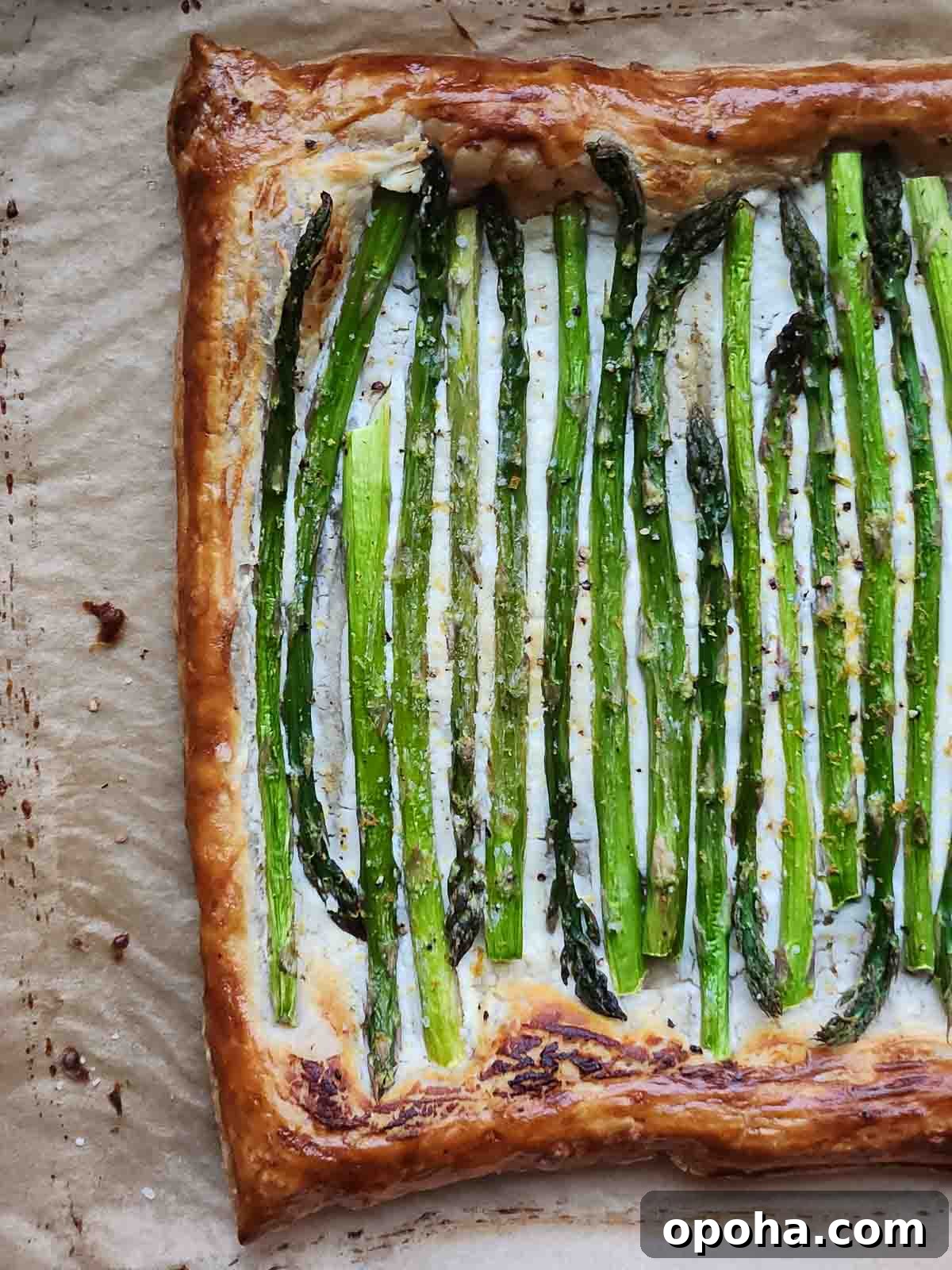 Asparagus Puff Pastry Tart with Whipped Goat Cheese Recipe 5 Asparagus and goat cheese puff pastry on parchment paper.