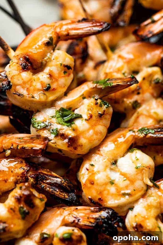 Up close view of shrimp on skewers after being grilled.