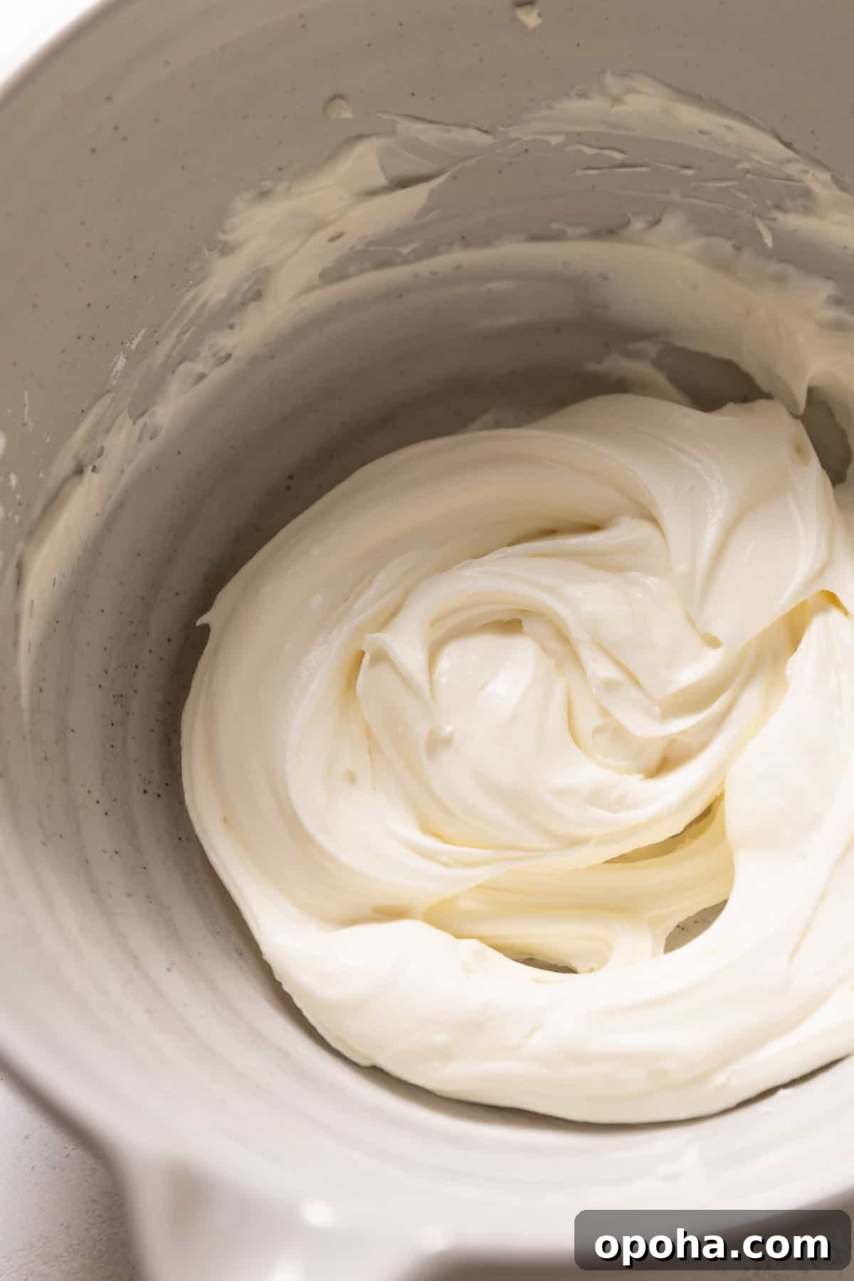 Lemon Berry Mascarpone Layer Cake 7 mascarpone frosting in a mixing bowl.
