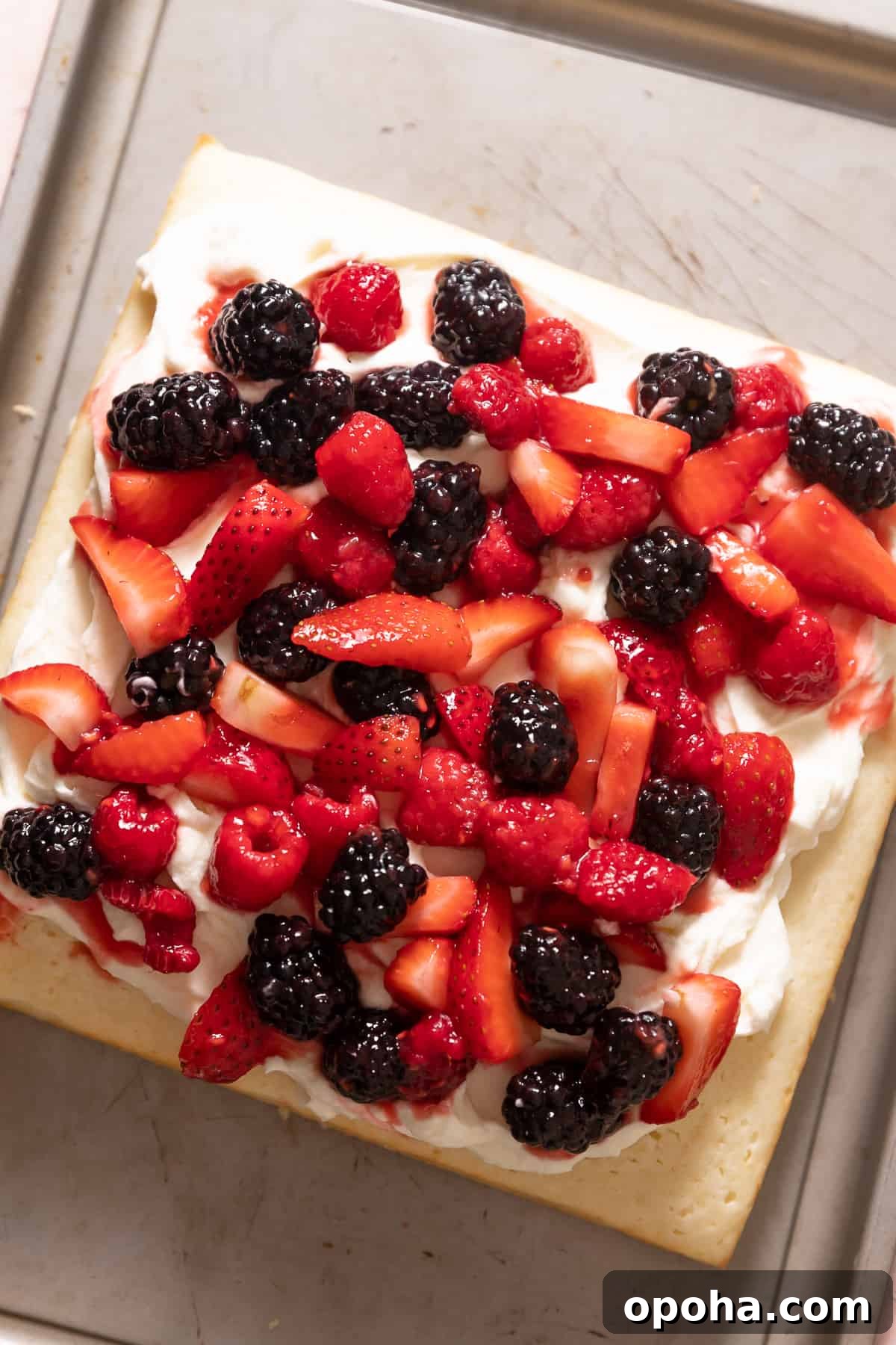 Lemon Berry Mascarpone Layer Cake 8 lemon cake with mascarpone frosting and fresh berries on top.