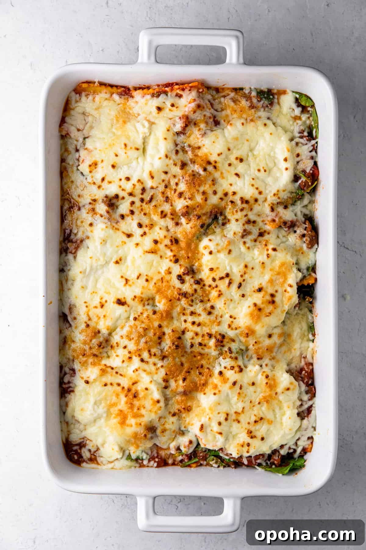 spinach ricotta ravioli in white casserole dish