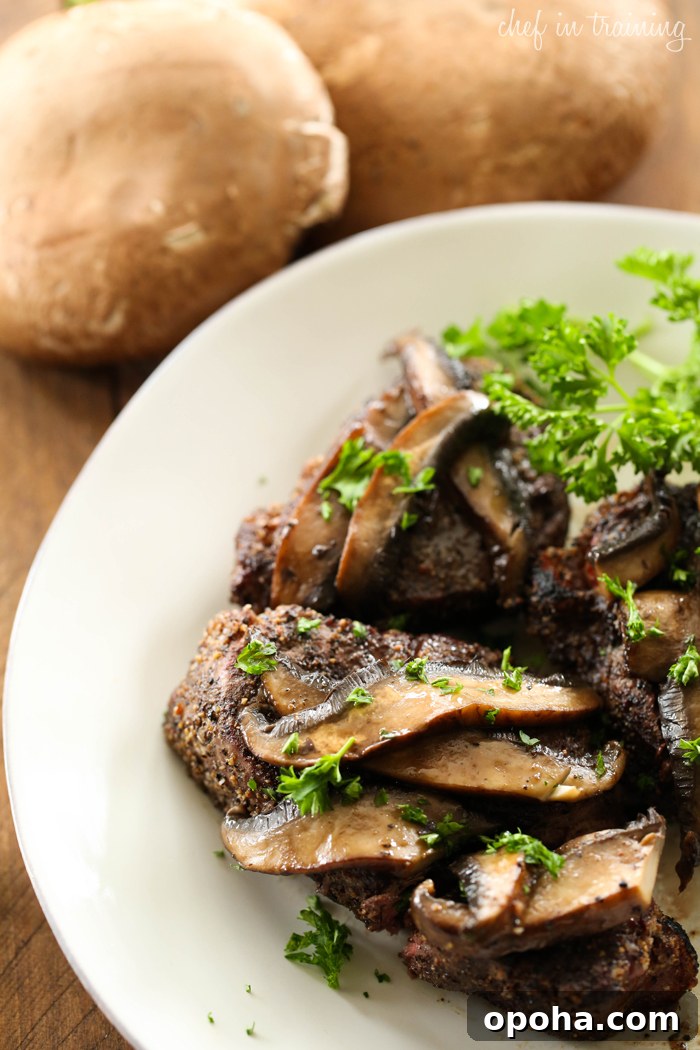 Close-up of steak with glazed portobello mushrooms