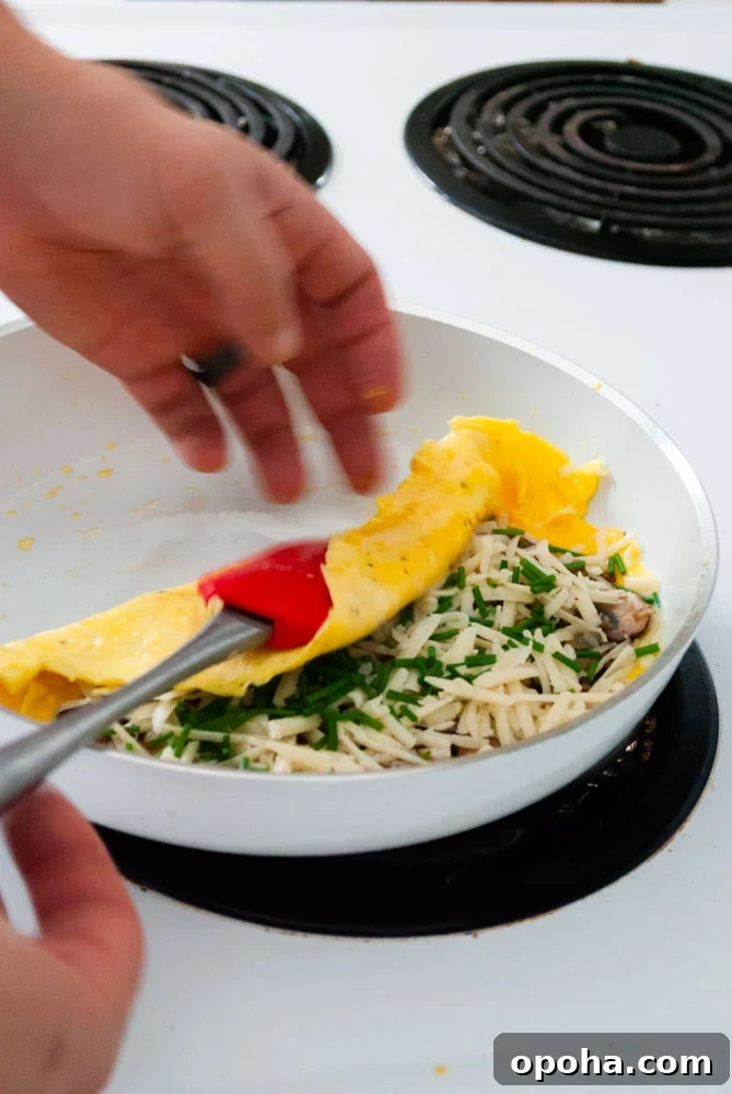 folding the omelette over