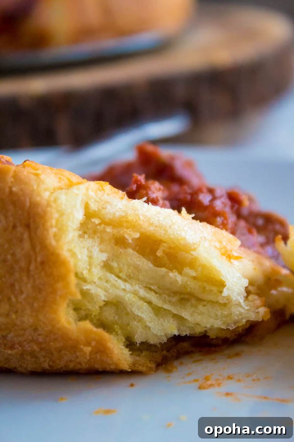 Authentic Chicago Deep-Dish Pizza Guide 8 Sliced Chicago deep dish pizza showing flaky crust