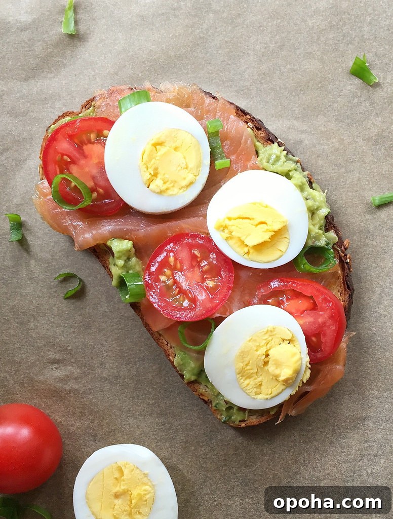 Avocado Toast with Smoked Salmon, Tomato, and Egg via LizsHealthyTable.com