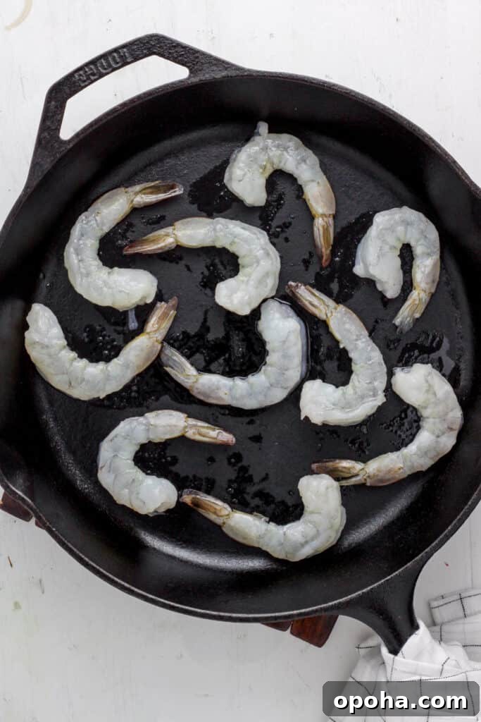 skillet with raw shrimp