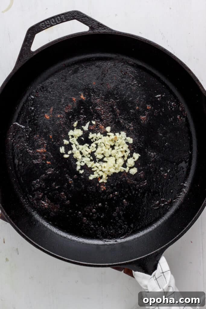 skillet with minced raw garlic