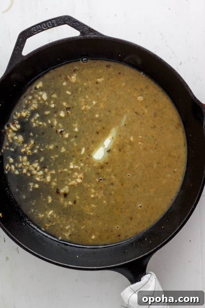 skillet with garlic and white wine and butter.