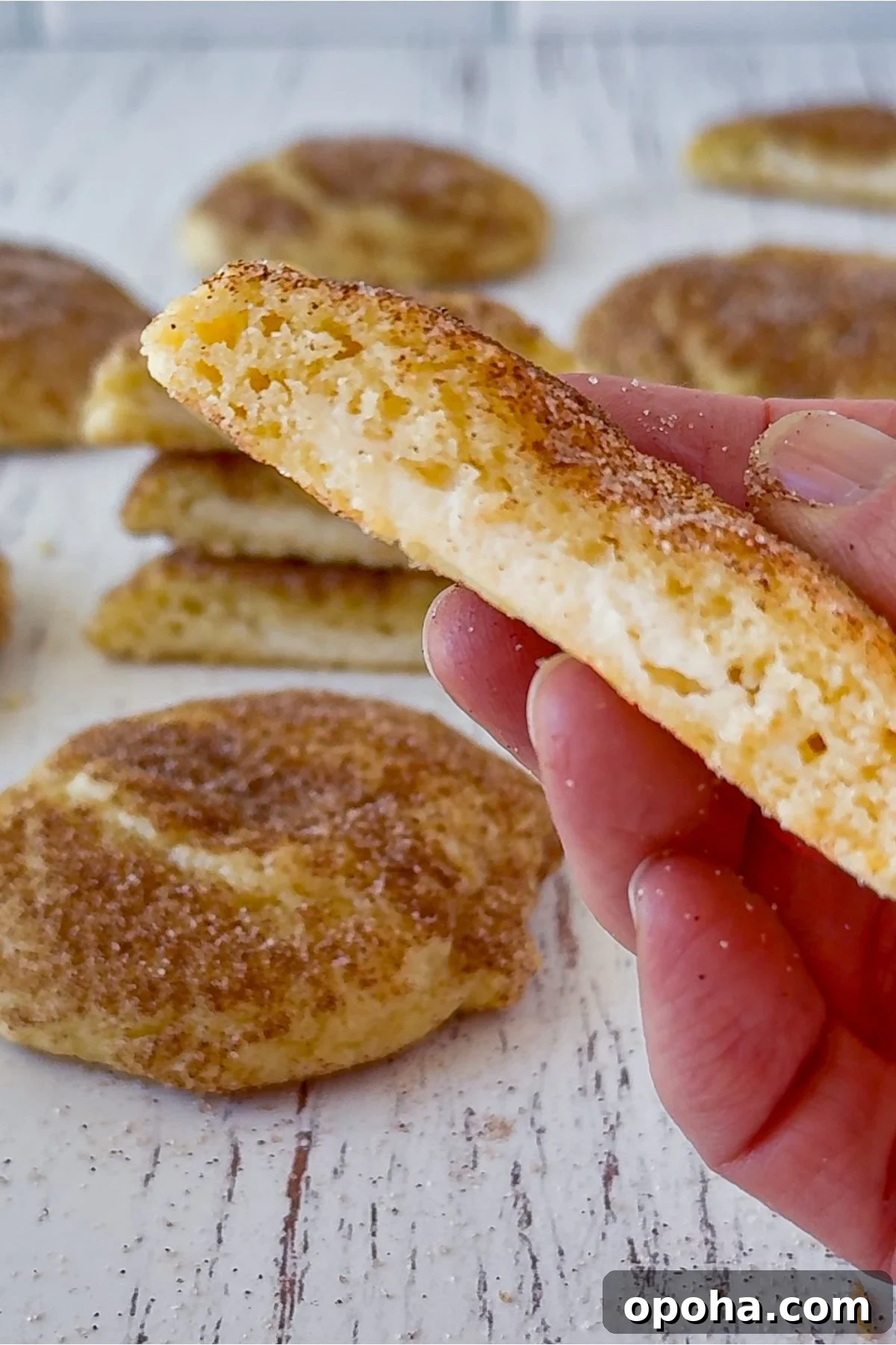 Churro cheesecake cookie in half.