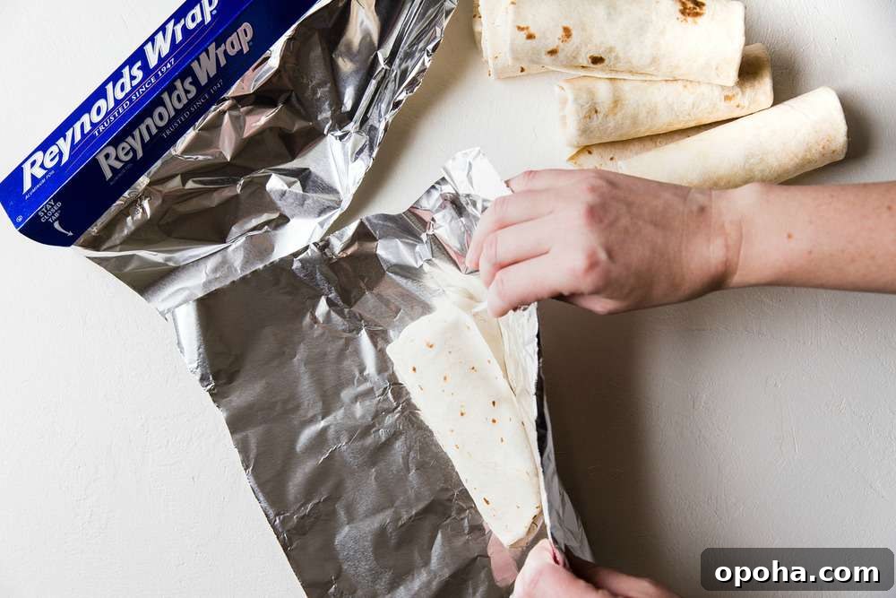 Wrap the burrito in aluminum foil.