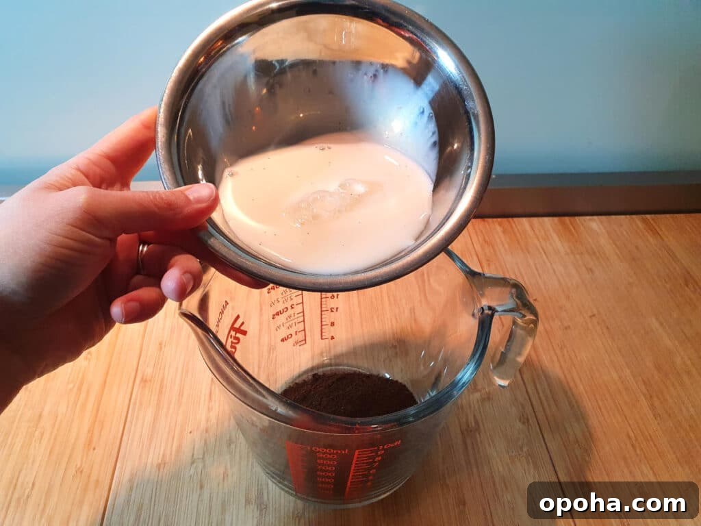 adding milk to coffee