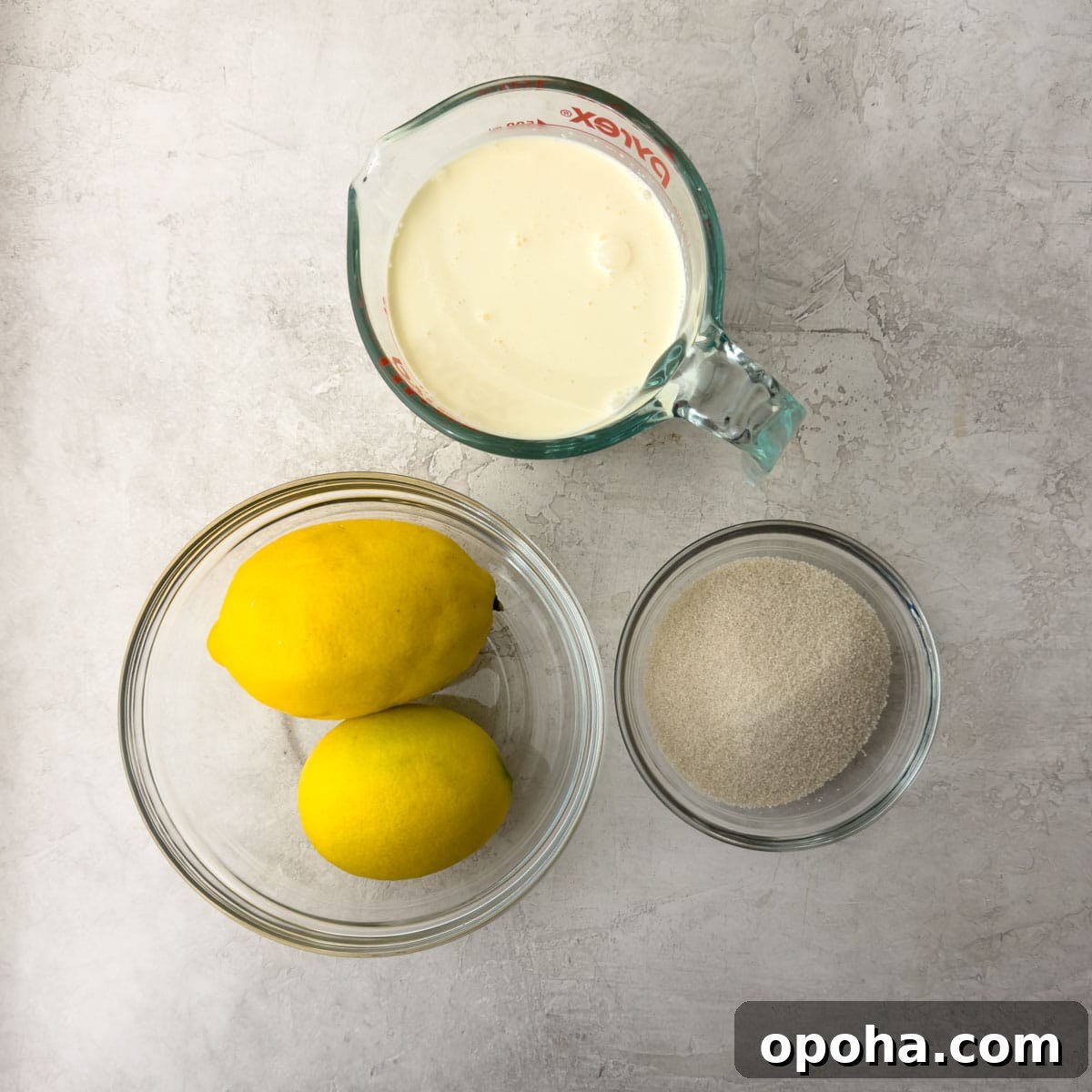 Lemons, sugar, and heavy cream to make lemon possets.