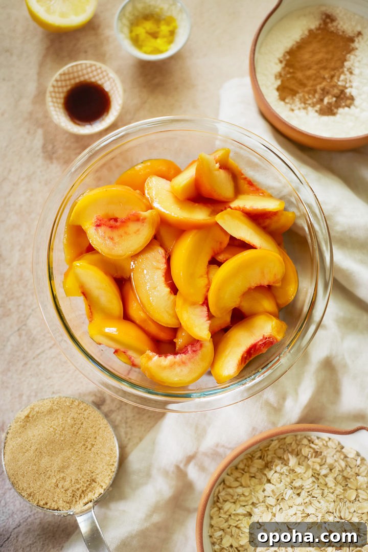 overhead photo of a bowl of peaches and other ingredients to make an easy peach crisp