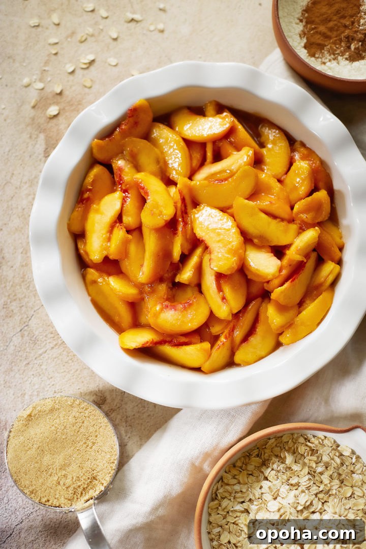 photo showing how to make recipe for peach crisp with oatmeal - a dish of fresh peaches with topping ingredients