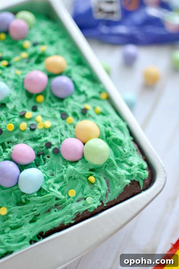 Decorated caramel brownies with green icing and M&M'S