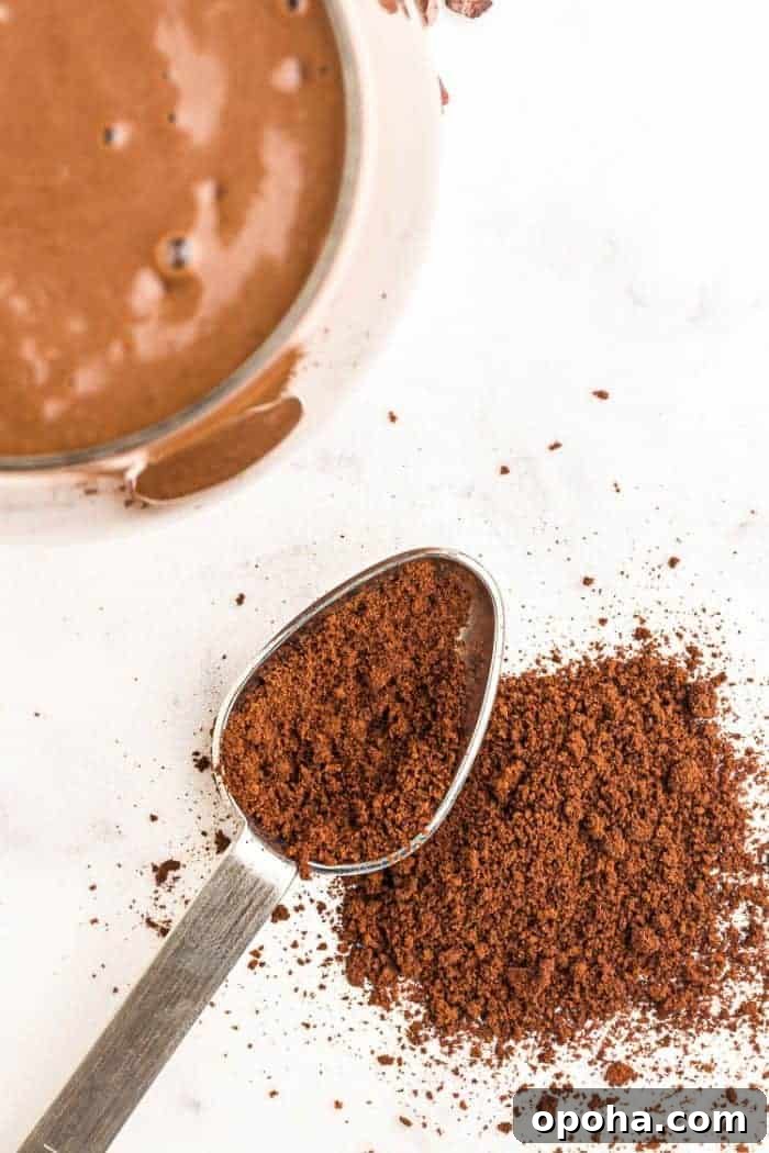Keto Chocolate Smoothie or Creamy Pudding 5 instant coffee granules on a spoon next to a smoothie